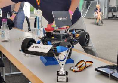 Trophy and gold medal autonomous race winning car